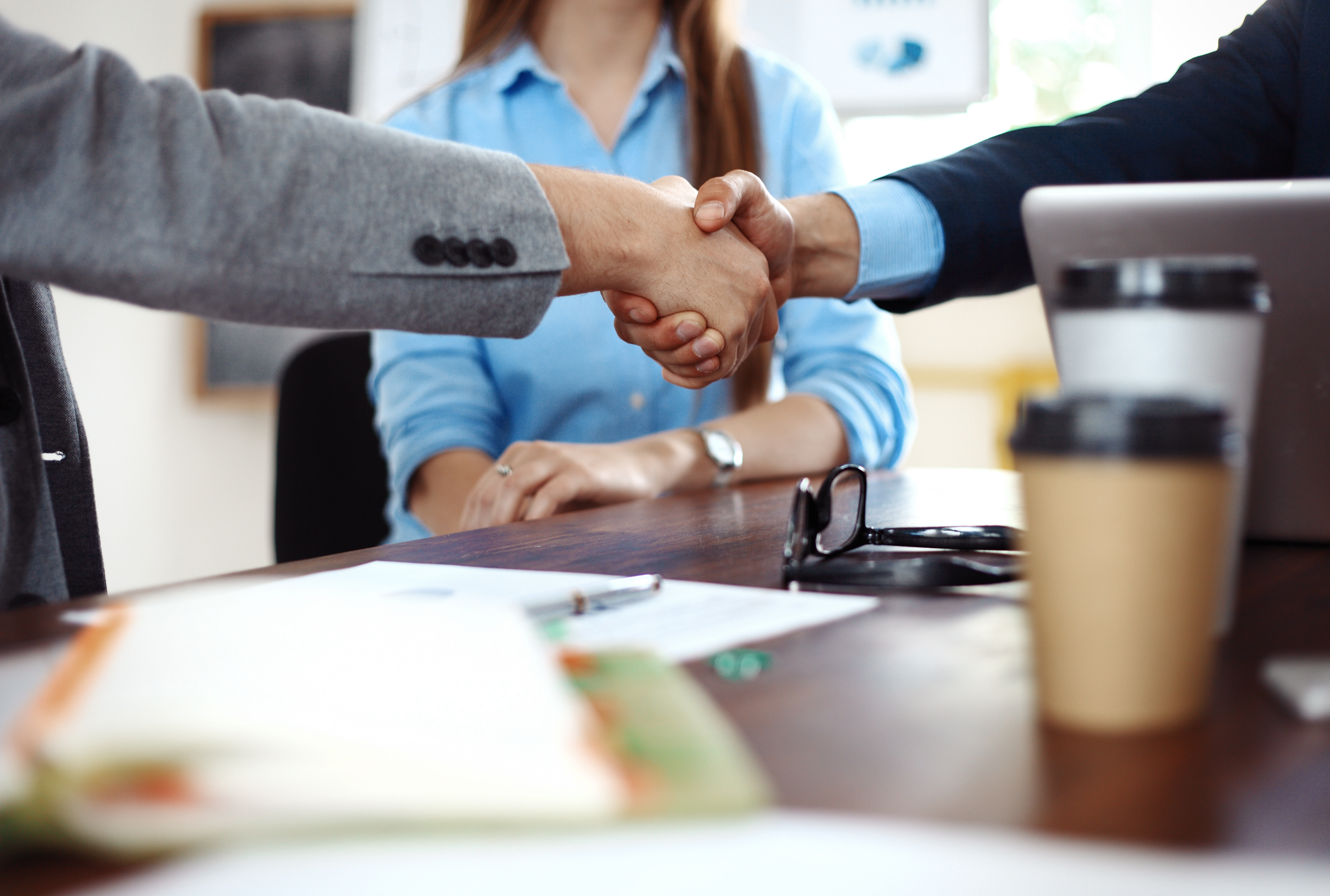 business-people-shaking-hands-finishing-up-meeting.jpg